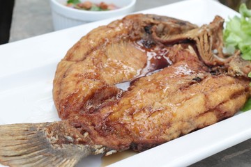 Fried snapper with fish sauce and spicy salad.