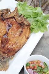 Fried snapper with fish sauce and spicy salad.