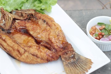 Fried snapper with fish sauce and spicy salad.