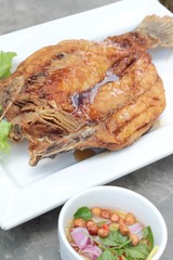 Fried snapper with fish sauce and spicy salad.