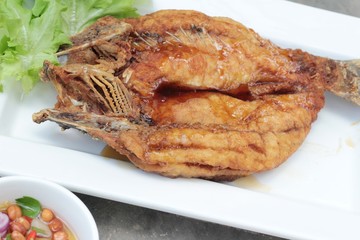 Fried snapper with fish sauce and spicy salad.