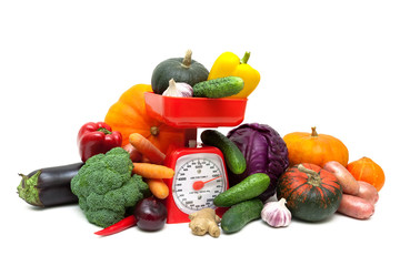 Fresh vegetables and kitchen scales.