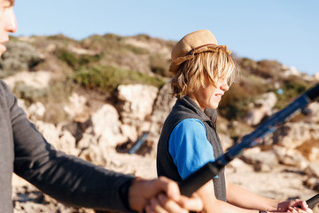 Teenage boy fishing at sea