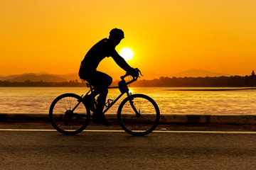 Fototapeta na wymiar Cycling at beach on twilight