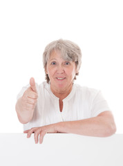 Old age woman showing thumbs up. All on white background.