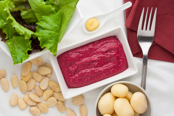 Beetroot sauce with almonds and potatoes.