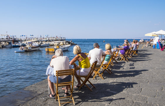 People Sitting And Relaxing At Marina Grande In Sorrento Italy