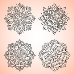 Set of four beautiful mandalas. Decorative ornamental elements. Vector illustration