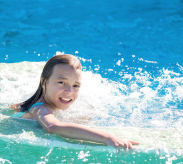Happy girl in pool