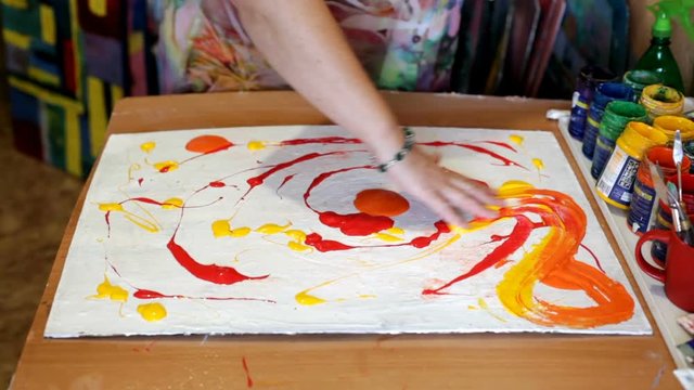 Abstract acrylic intuitive painting process. Woman artist drawing picture