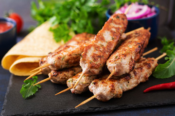 Minced Lula kebab grilled turkey (chicken) with vegetables.