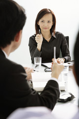 Businesswoman and businessman having a discussion in a meeting