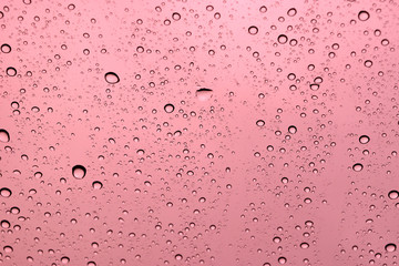 abstract water drop on windshield or water drop on orange backgr