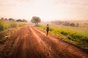 women running in savanna morning