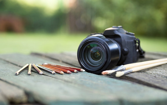 Camera with pencil and brush