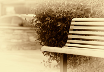 Simple park bench in Norway sepia background
