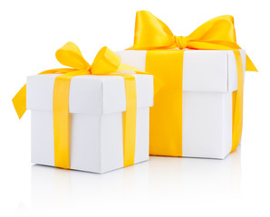 Two white gift boxs tied a yellow satin ribbon bow Isolated on w