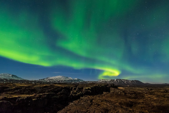 Aurora borealis over the Thingvellir National Park - Iceland © Puripat