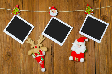 Naklejka na ściany i meble Christmas picture frame on a wooden background, space for writin