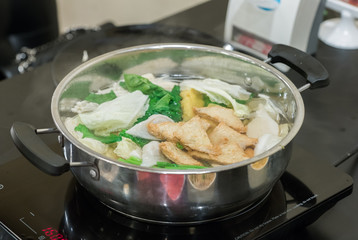 Restaurant menu in sukiyaki pot. Shabu.
