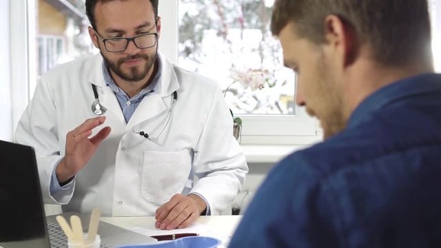 men's health - doctor giving consultation to male patient