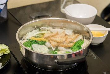 Restaurant menu in sukiyaki pot. Shabu.

