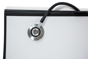 Close-up of clipboard with stethoscope