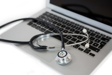 Close-up of stethoscope on laptop