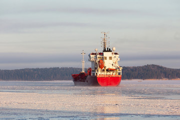 MORKO SWEDEN 24 January 2016. Freight ship in cloudy winter weather and morning mist