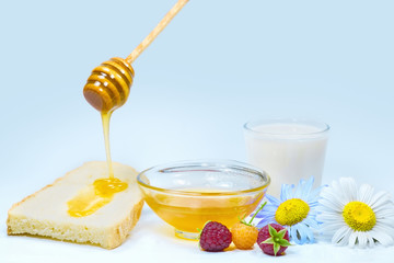 Honey dripping on a fresh slice of bread