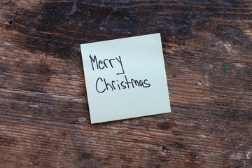 Message Merry Christmas on wooden table