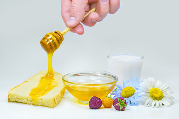 Honey dripping on a fresh slice of bread