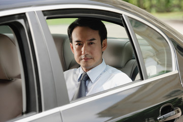 Fototapeta na wymiar Businessman sitting in car