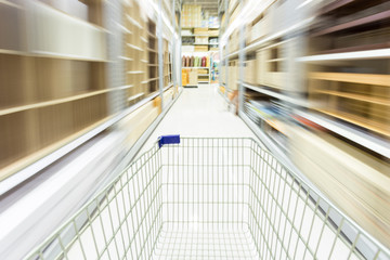 shopping cart in supermarket with blur motion