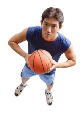 Fototapeta premium Young man holding basketball