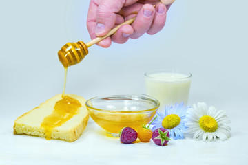 Honey dripping on a slice of bread
