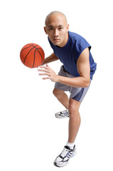 Young man holding basketball, preparing to shoot