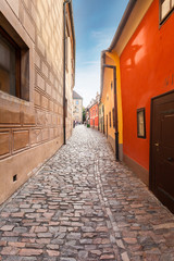 Golden street inside of Old Royal Palace in Prague, Czech Republic. Multicolored houses authentic retro.