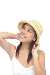 Young woman wearing hat, looking away, smiling