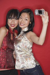 Two women taking a picture of themselves