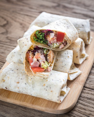 Chicken burritos on the wooden background