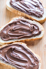 Slices of baguette with chocolate cream