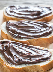 Slices of baguette with chocolate cream