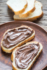 Slices of baguette with chocolate cream