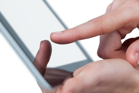Hands using digital tablet against white background