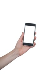 Hand holding mobile phone against white background