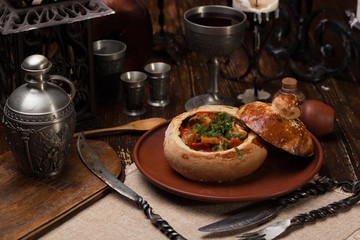 Baked vegetables laid out in a bread pot