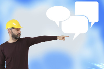 Close of businessman hand pointing with engineer finger at gear talking balloon