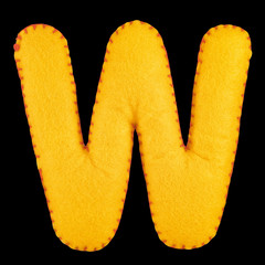 W- letter from yellow felt. Collection of colorful handmade English alphabet isolate on black background