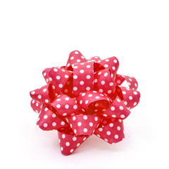 red gift puff bow patterned with white dots